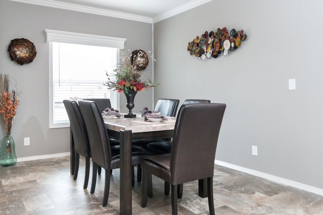 The K3060A Dining Area. This Manufactured Mobile Home features 3 bedrooms and 2 baths.