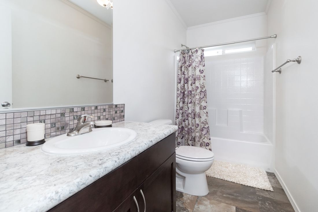 The K3060A Guest Bathroom. This Manufactured Mobile Home features 3 bedrooms and 2 baths.