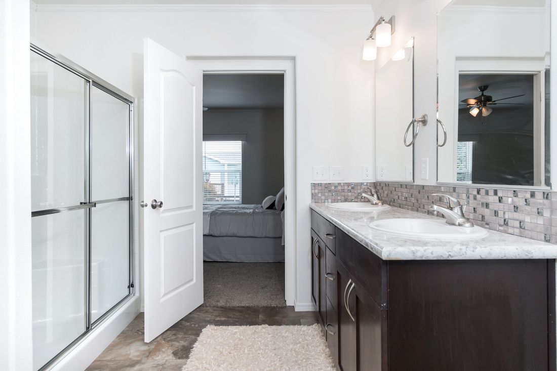 The K3060A Primary Bathroom. This Manufactured Mobile Home features 3 bedrooms and 2 baths.