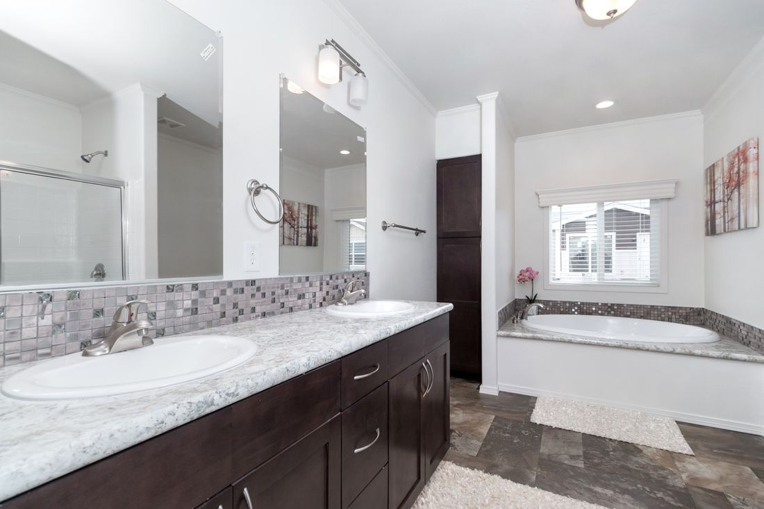 The K3060A Primary Bathroom. This Manufactured Mobile Home features 3 bedrooms and 2 baths.