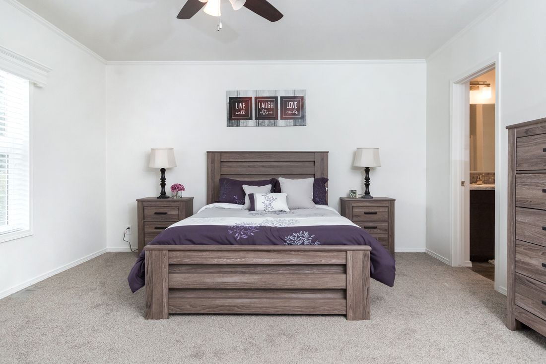 The K3060A Primary Bedroom. This Manufactured Mobile Home features 3 bedrooms and 2 baths.