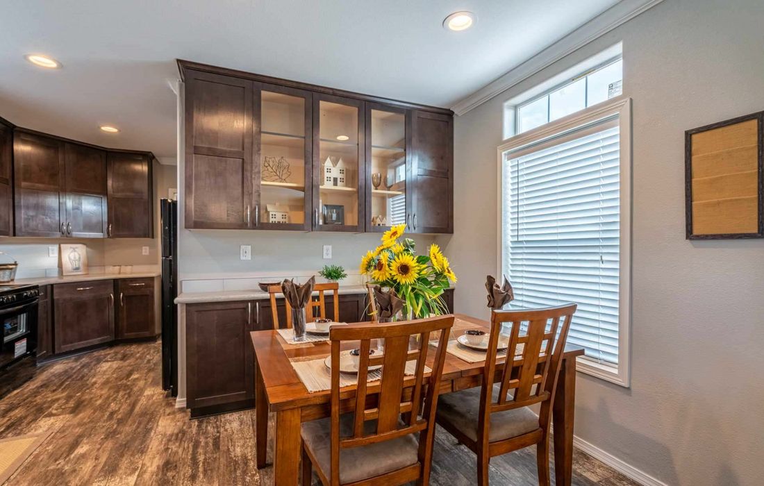 The K1676H Dining Area. This Manufactured Mobile Home features 3 bedrooms and 2 baths.