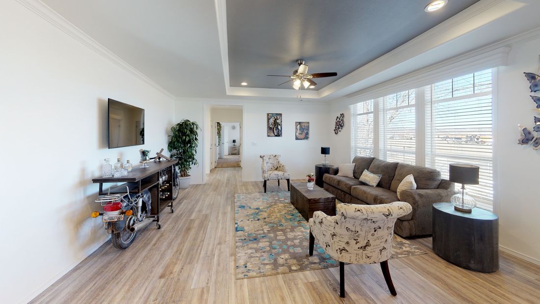 The SUM3068A Living Room. This Manufactured Mobile Home features 3 bedrooms and 2 baths.