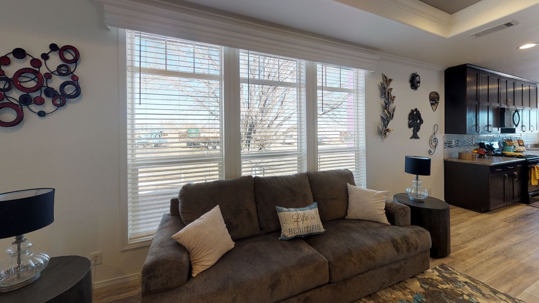 The SUM3068A Living Room. This Manufactured Mobile Home features 3 bedrooms and 2 baths.