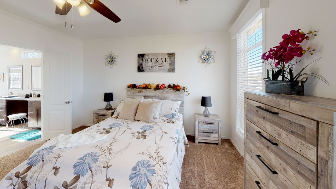 The SUM3068A Primary Bedroom. This Manufactured Mobile Home features 3 bedrooms and 2 baths.