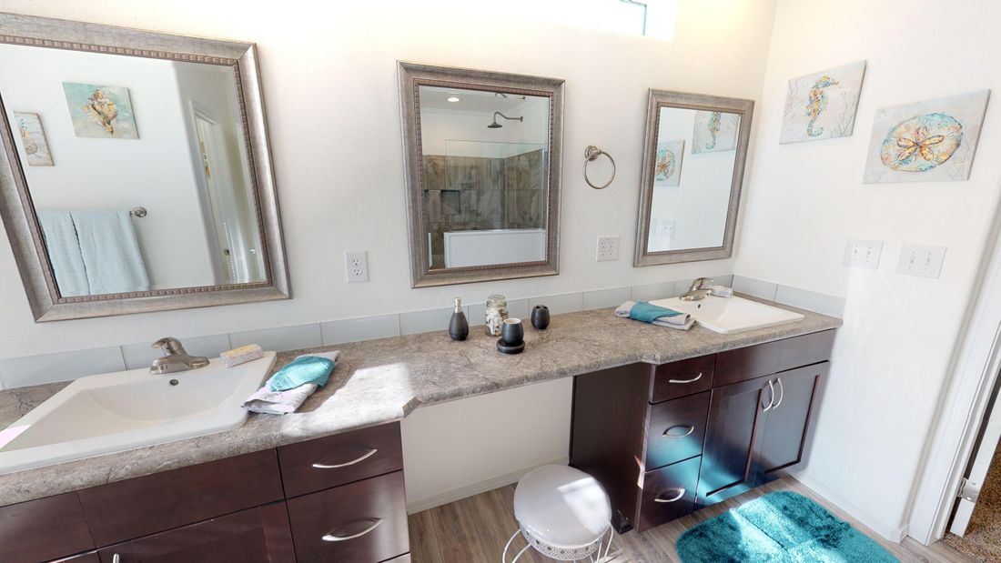 The SUM3068A Primary Bathroom. This Manufactured Mobile Home features 3 bedrooms and 2 baths.