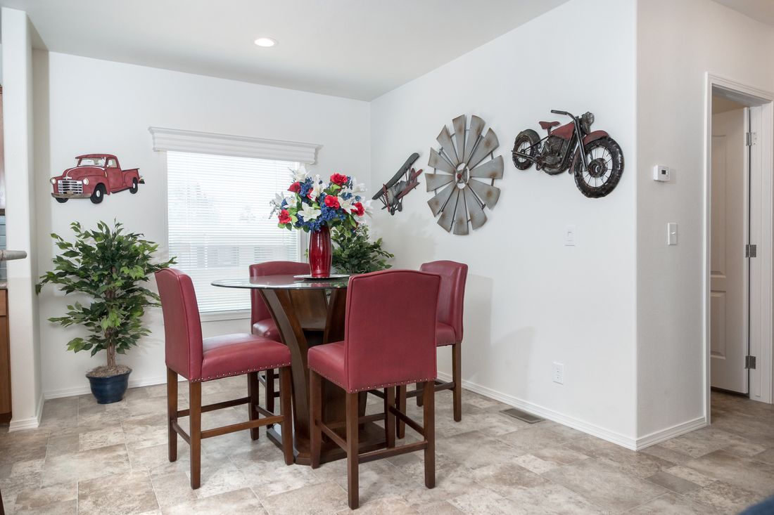 The K2760A Dining Area. This Manufactured Mobile Home features 3 bedrooms and 2 baths.