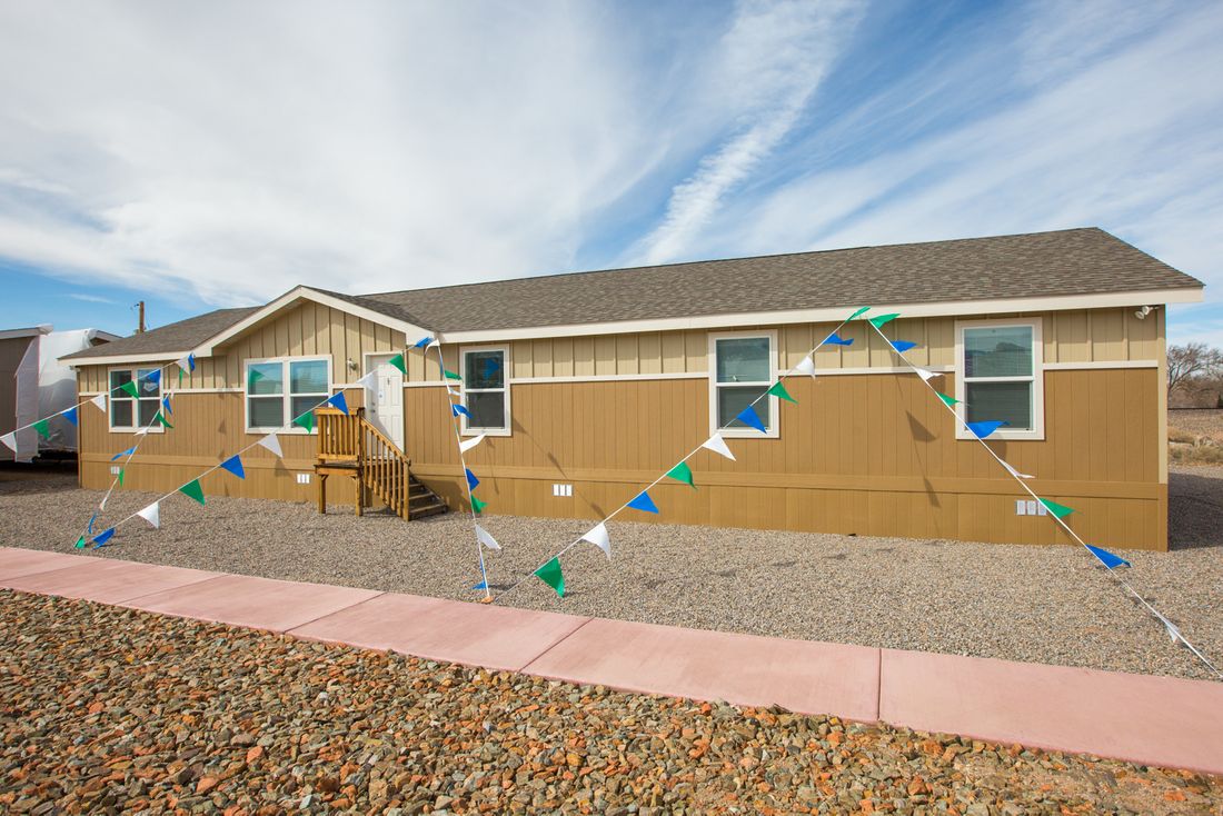 The THE WAVE Exterior. This Manufactured Mobile Home features 4 bedrooms and 2 baths.