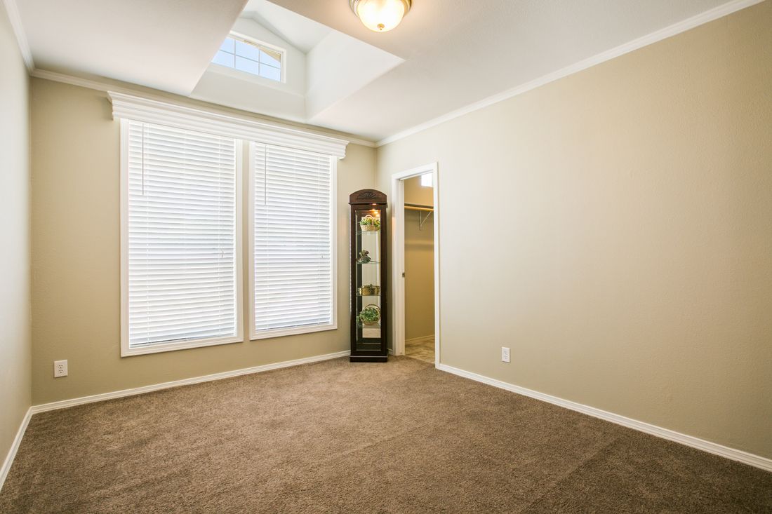 The TRANQUILITY TR3062A Bedroom. This Manufactured Mobile Home features 3 bedrooms and 2 baths.