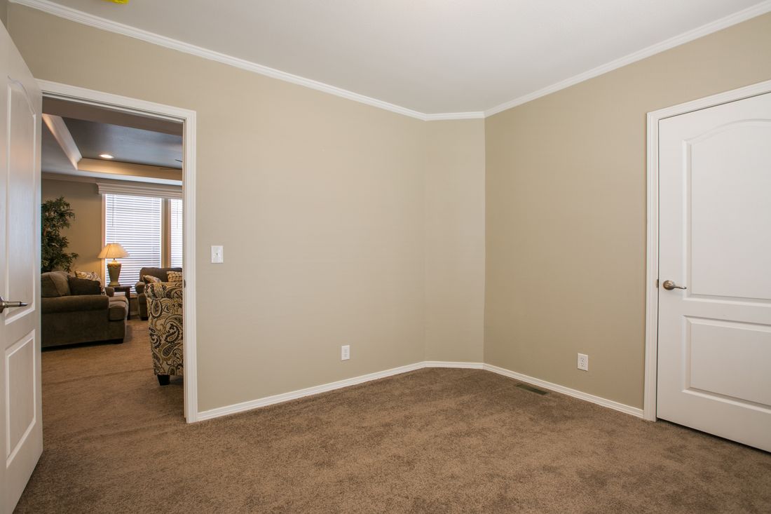 The TRANQUILITY TR3062A Bedroom. This Manufactured Mobile Home features 3 bedrooms and 2 baths.