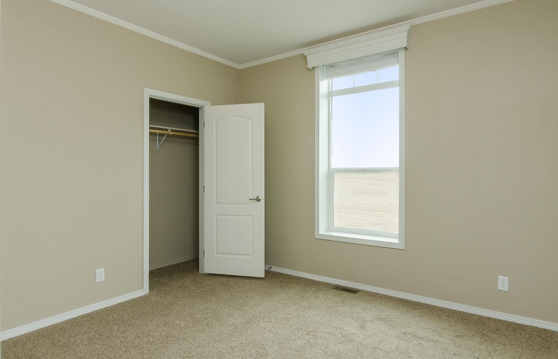 The TRANQUILITY TR3062A Primary Bedroom. This Manufactured Mobile Home features 3 bedrooms and 2 baths.