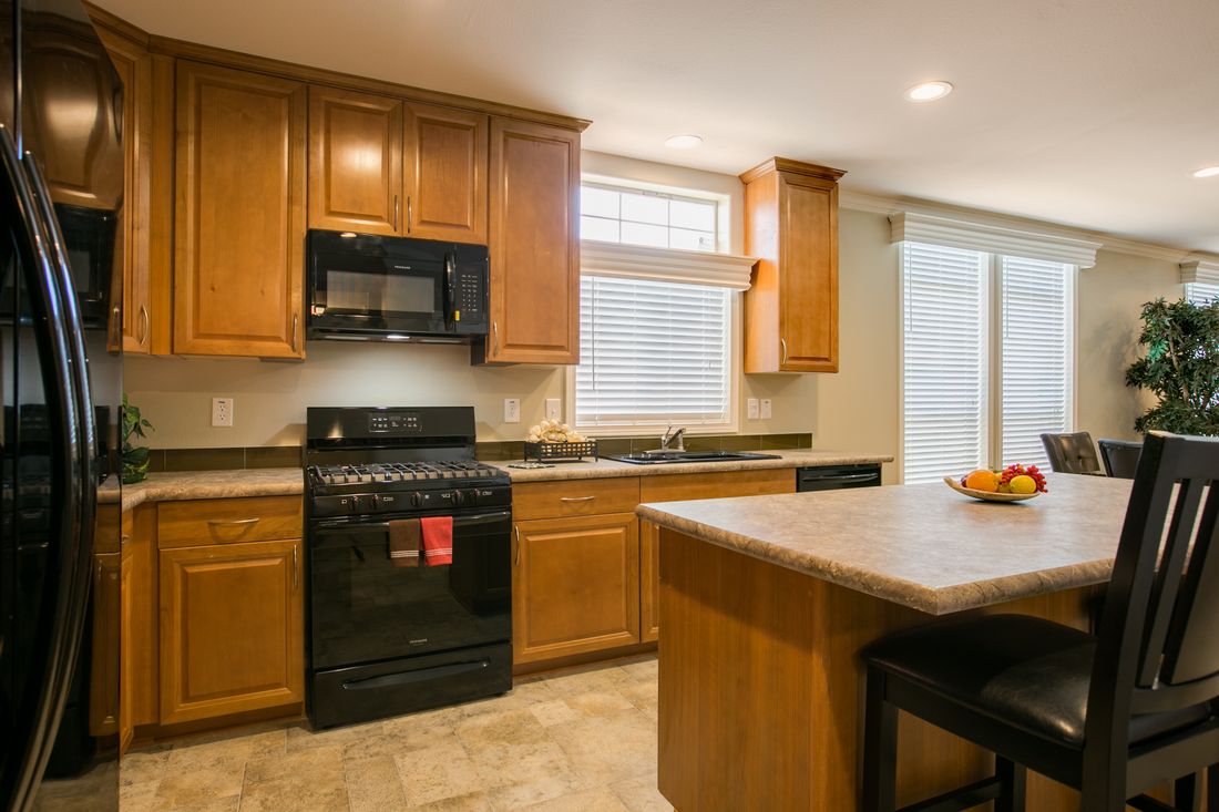 The TRANQUILITY TR3062A Kitchen. This Manufactured Mobile Home features 3 bedrooms and 2 baths.
