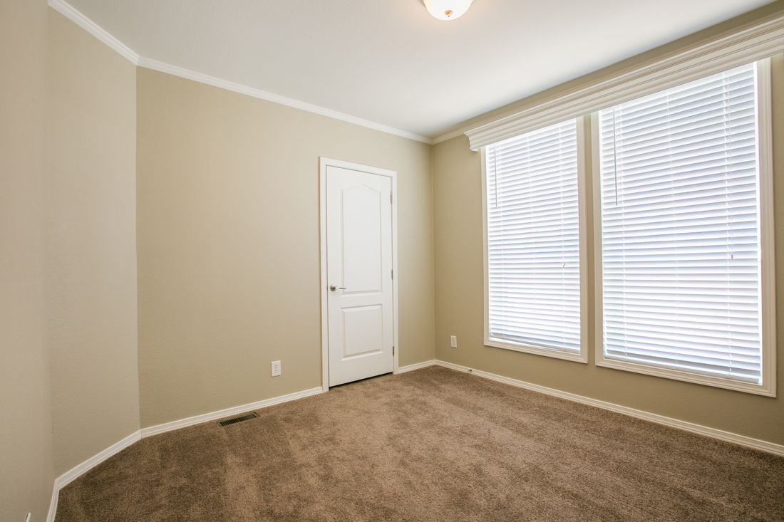 The TRANQUILITY TR3062A Bedroom. This Manufactured Mobile Home features 3 bedrooms and 2 baths.