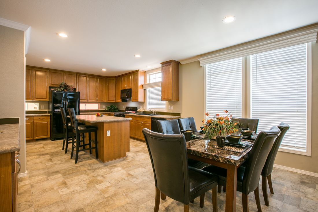 The TRANQUILITY TR3062A Dining Area. This Manufactured Mobile Home features 3 bedrooms and 2 baths.