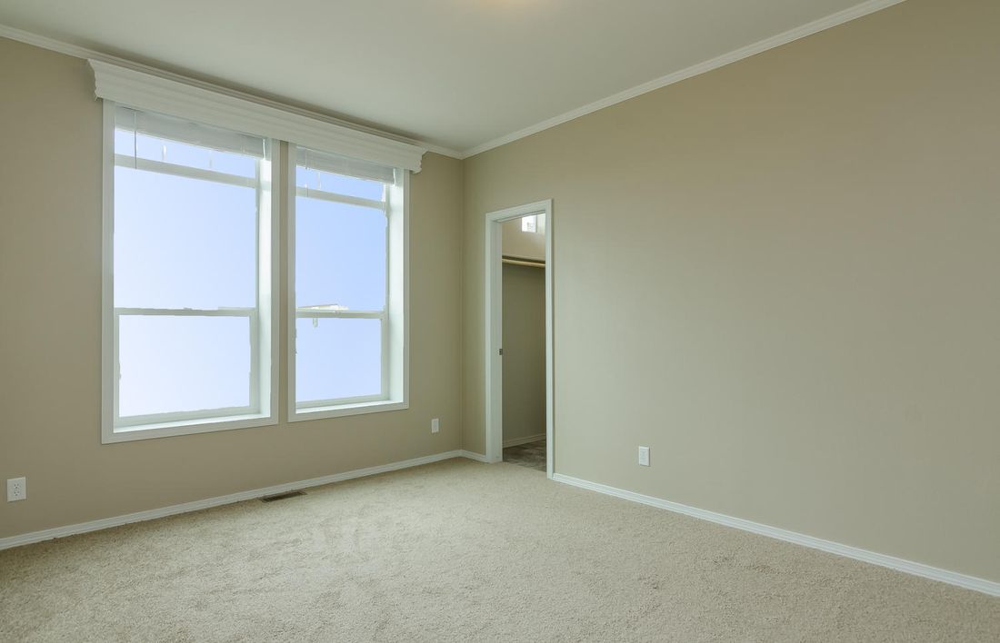The TRANQUILITY TR3062A Primary Bedroom. This Manufactured Mobile Home features 3 bedrooms and 2 baths.