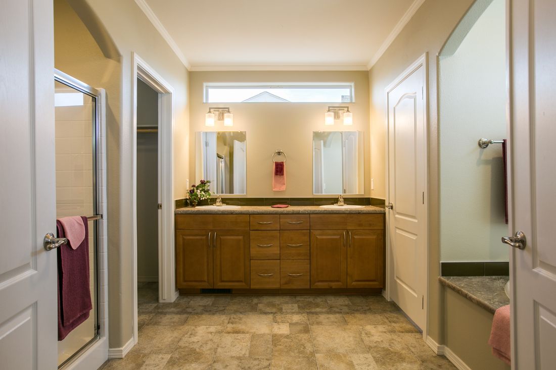 The TRANQUILITY TR3062A Primary Bathroom. This Manufactured Mobile Home features 3 bedrooms and 2 baths.