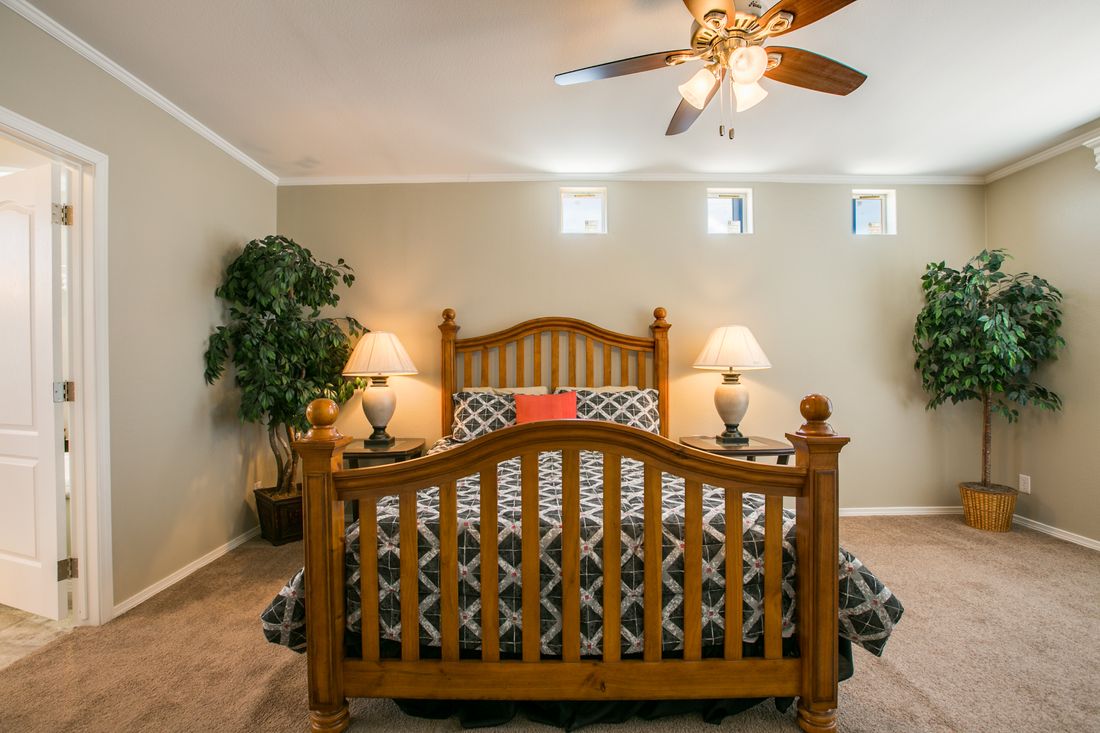 The TRANQUILITY TR3062A Primary Bedroom. This Manufactured Mobile Home features 3 bedrooms and 2 baths.