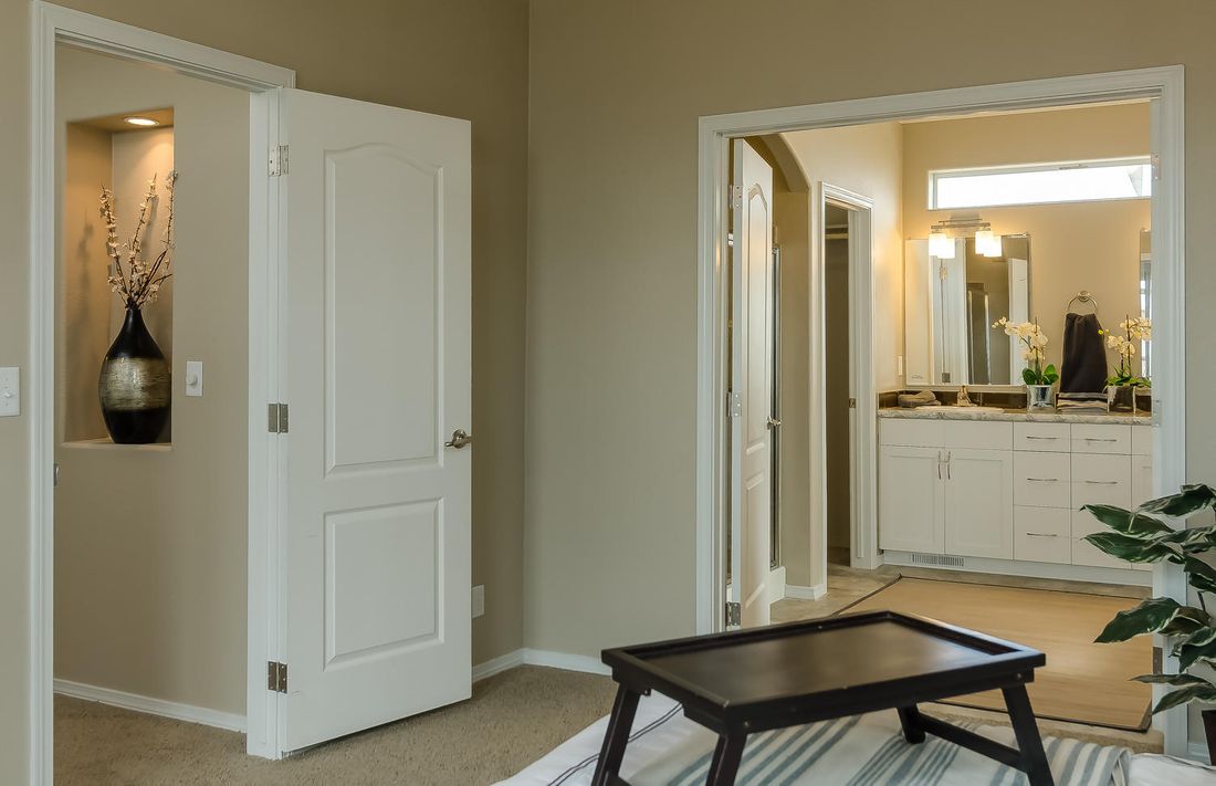 The TRANQUILITY TR3062A Primary Bedroom. This Manufactured Mobile Home features 3 bedrooms and 2 baths.