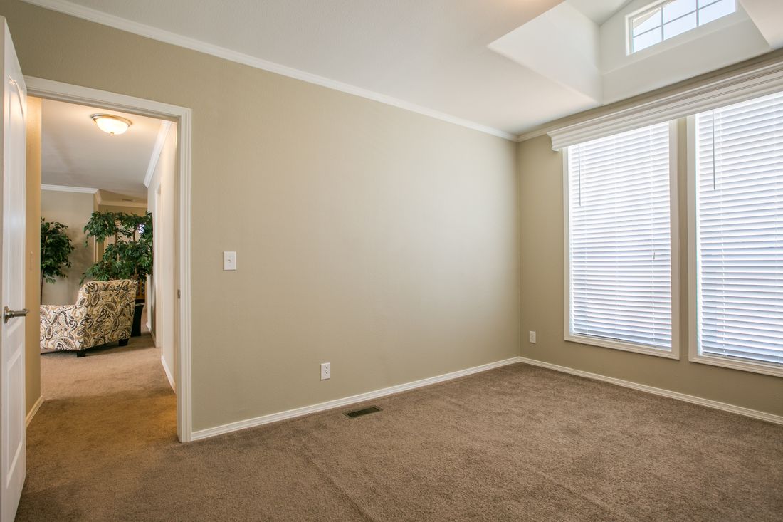 The TRANQUILITY TR3062A Bedroom. This Manufactured Mobile Home features 3 bedrooms and 2 baths.