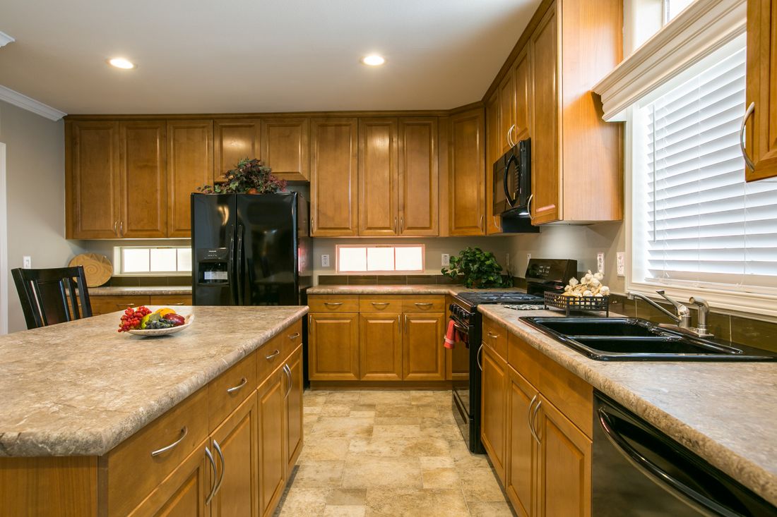The TRANQUILITY TR3062A Kitchen. This Manufactured Mobile Home features 3 bedrooms and 2 baths.