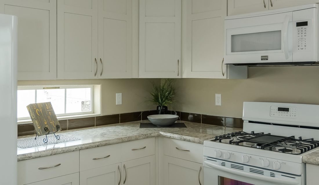 The TRANQUILITY TR3062A Kitchen. This Manufactured Mobile Home features 3 bedrooms and 2 baths.