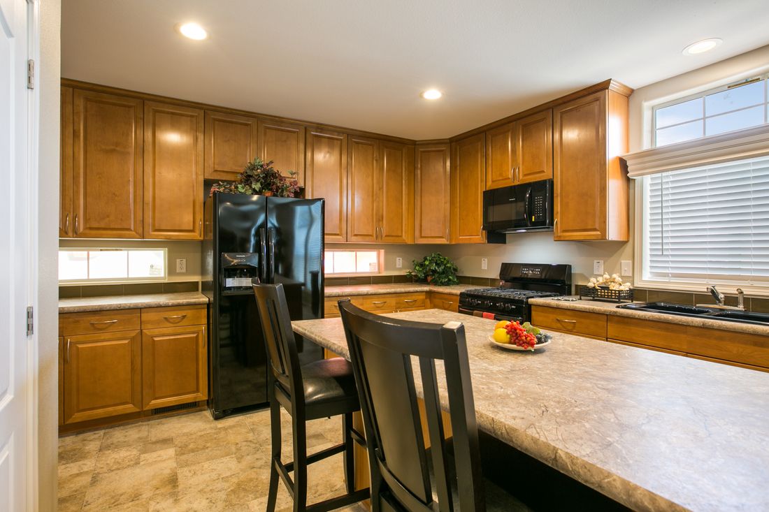 The TRANQUILITY TR3062A Kitchen. This Manufactured Mobile Home features 3 bedrooms and 2 baths.