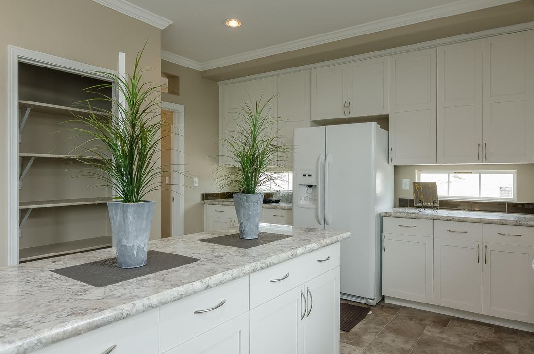 The TRANQUILITY TR3062A Kitchen. This Manufactured Mobile Home features 3 bedrooms and 2 baths.