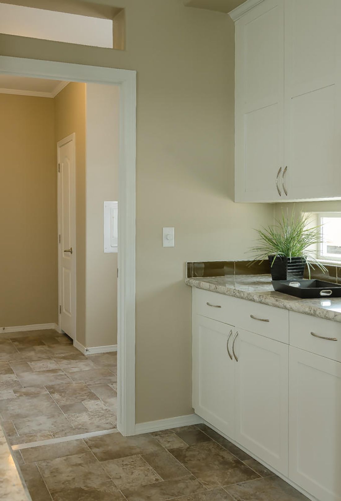 The TRANQUILITY TR3062A Kitchen. This Manufactured Mobile Home features 3 bedrooms and 2 baths.