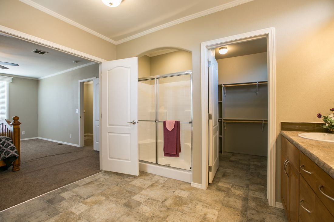 The TRANQUILITY TR3062A Primary Bathroom. This Manufactured Mobile Home features 3 bedrooms and 2 baths.