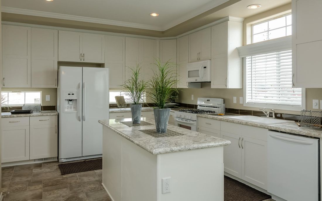 The TRANQUILITY TR3062A Kitchen. This Manufactured Mobile Home features 3 bedrooms and 2 baths.