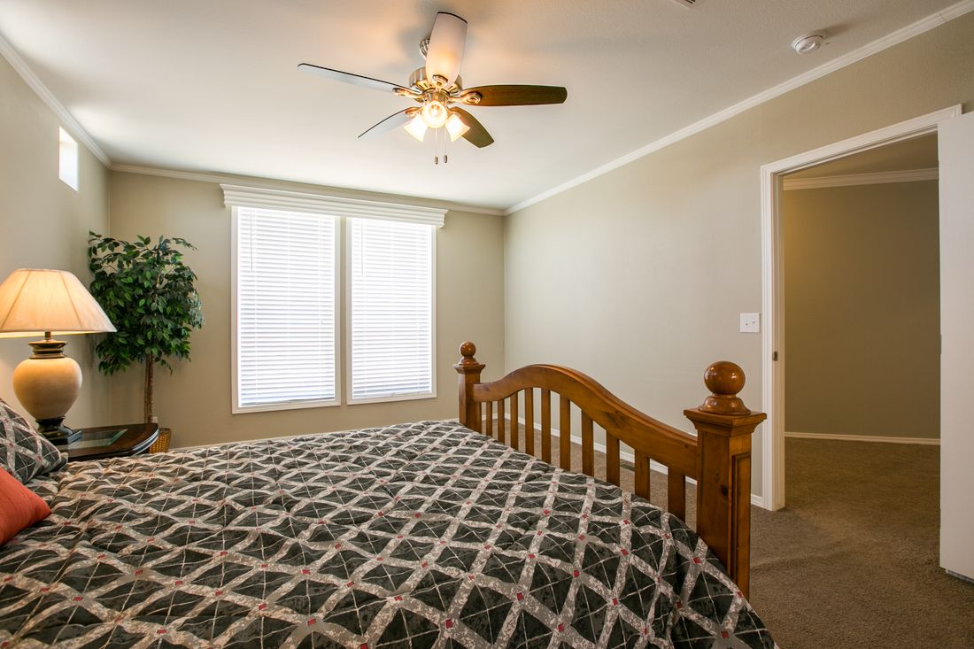 The TRANQUILITY TR3062A Primary Bedroom. This Manufactured Mobile Home features 3 bedrooms and 2 baths.