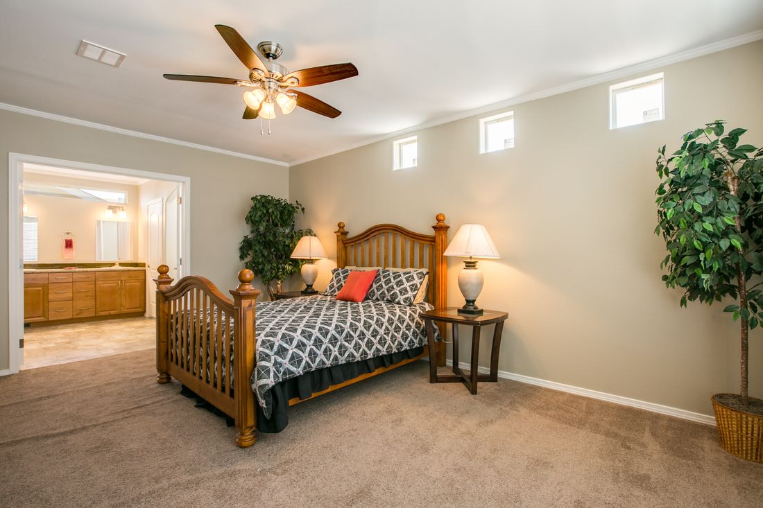 The TRANQUILITY TR3062A Primary Bedroom. This Manufactured Mobile Home features 3 bedrooms and 2 baths.