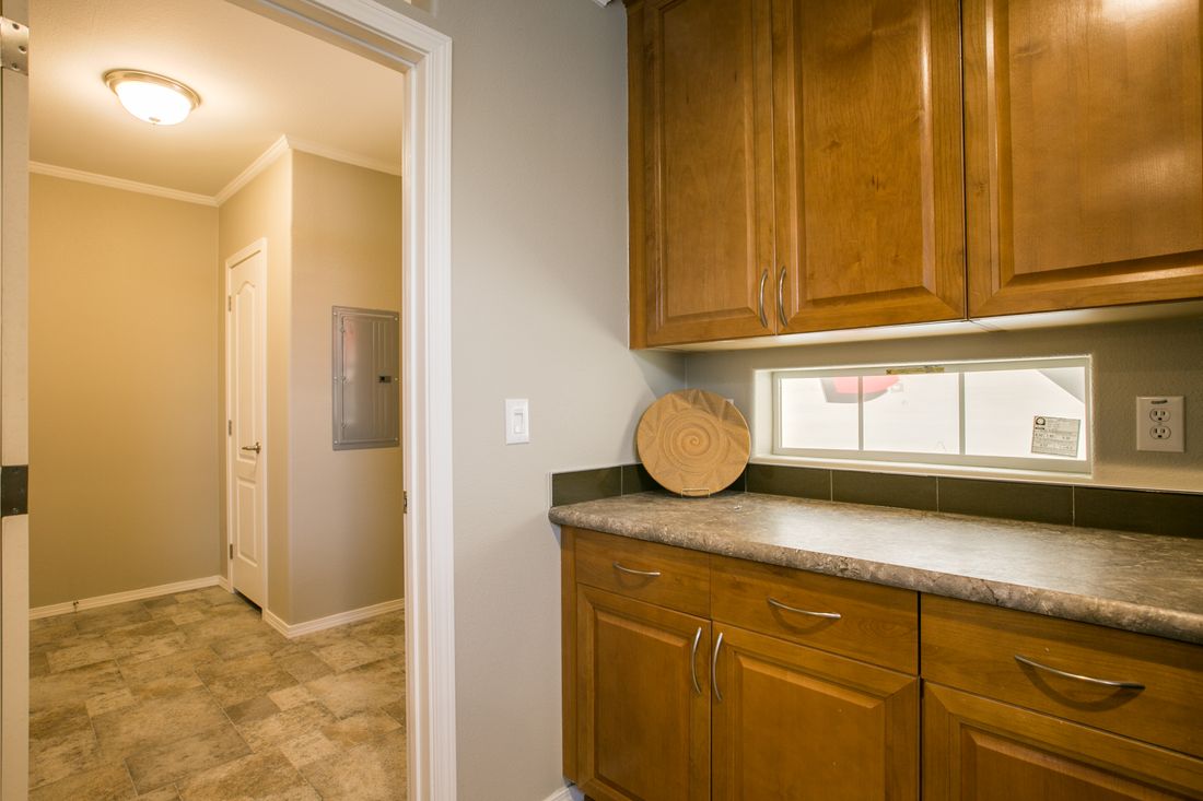 The TRANQUILITY TR3062A Kitchen. This Manufactured Mobile Home features 3 bedrooms and 2 baths.