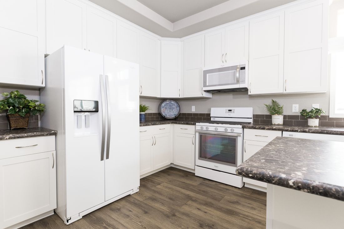 The ENCHANTMENT 3070A Kitchen. This Manufactured Mobile Home features 3 bedrooms and 2 baths.