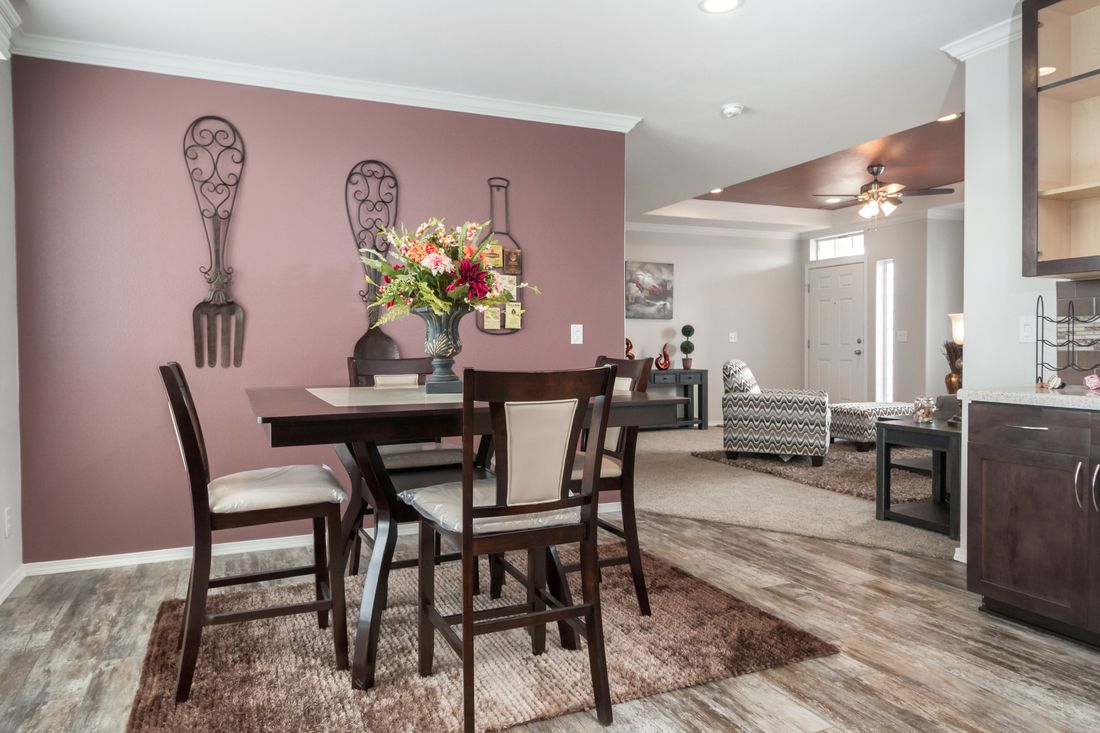 The ENCHANTMENT 3070A Dining Area. This Manufactured Mobile Home features 3 bedrooms and 2 baths.