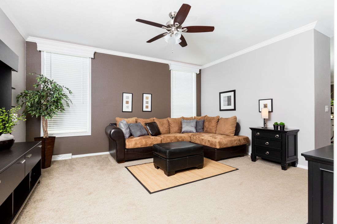 The ENCHANTMENT 3070A Living Room. This Manufactured Mobile Home features 3 bedrooms and 2 baths.