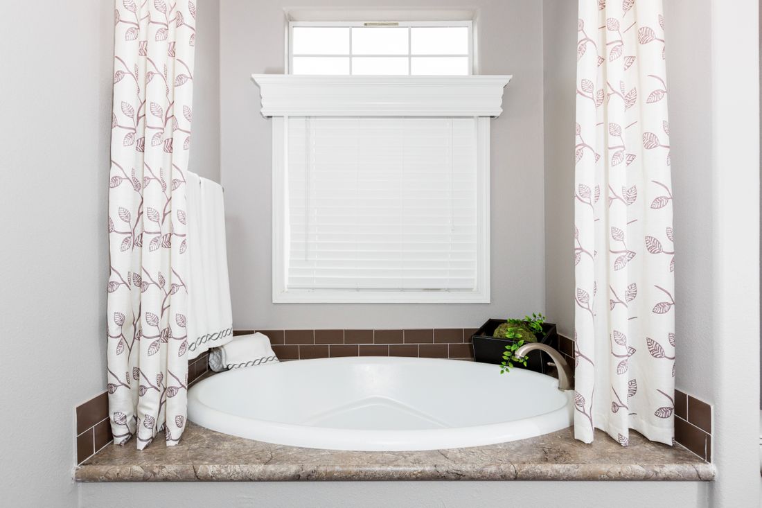 The ENCHANTMENT 3070A Guest Bathroom. This Manufactured Mobile Home features 3 bedrooms and 2 baths.