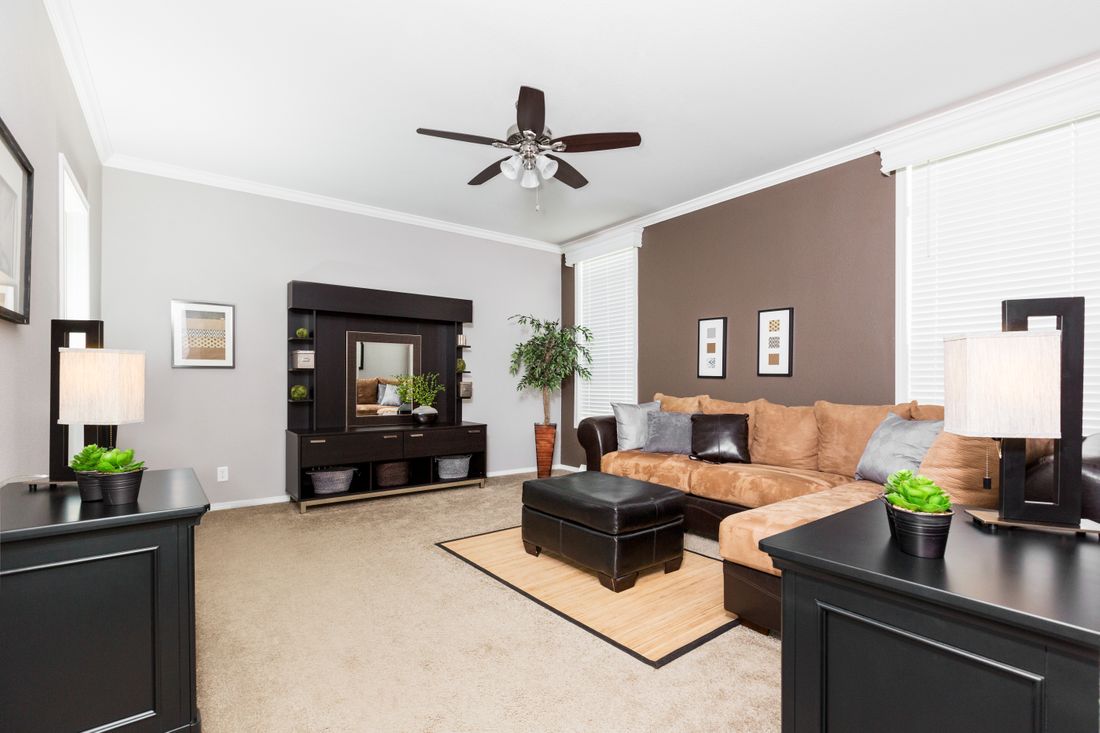 The ENCHANTMENT 3070A Living Room. This Manufactured Mobile Home features 3 bedrooms and 2 baths.