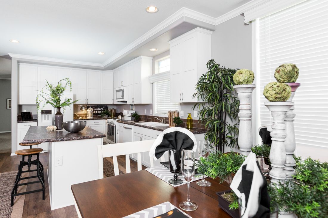 The ENCHANTMENT 3070A Kitchen. This Manufactured Mobile Home features 3 bedrooms and 2 baths.