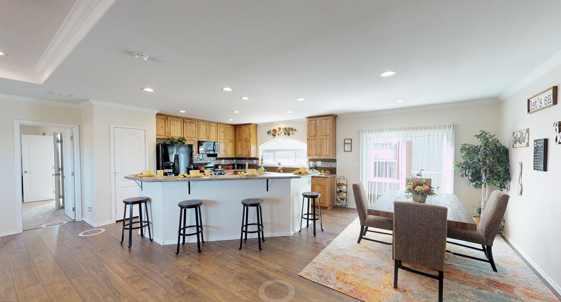 The K3066A Dining Room. This Manufactured Mobile Home features 3 bedrooms and 2 baths.