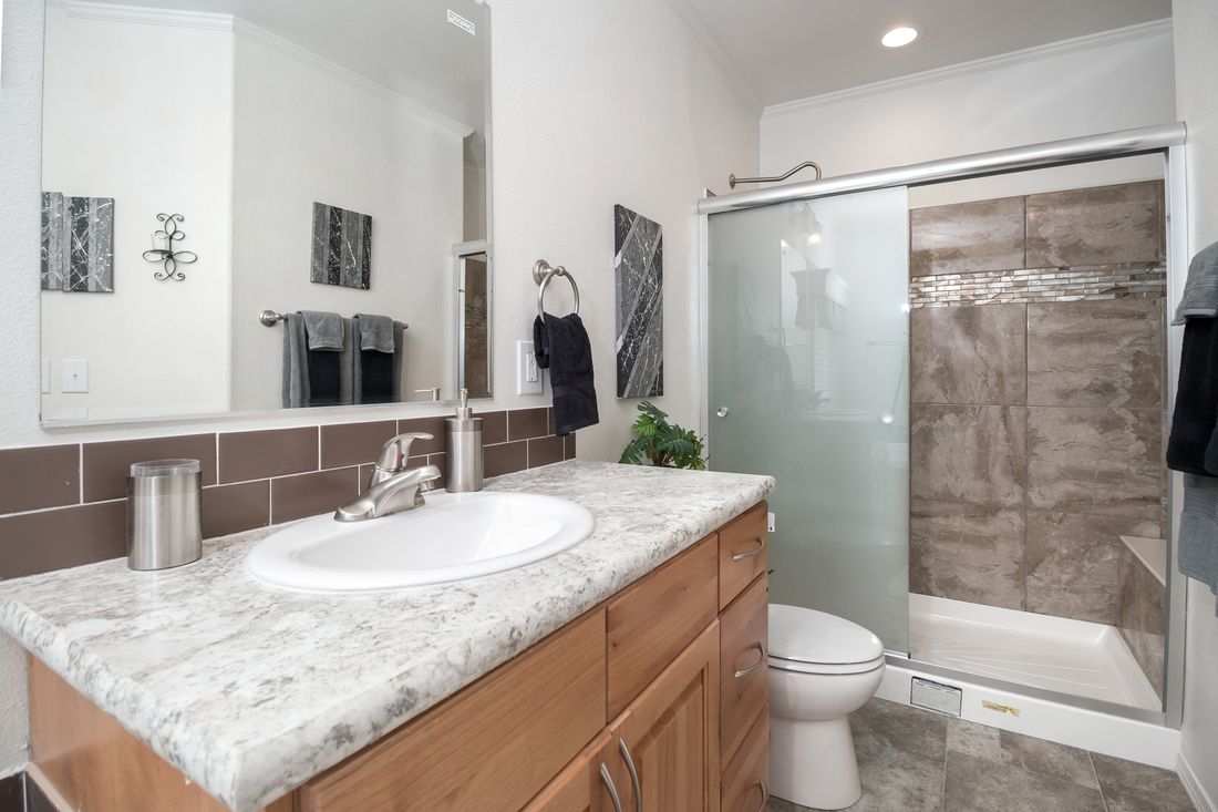 The K3068C Primary Bathroom. This Manufactured Mobile Home features 3 bedrooms and 2 baths.