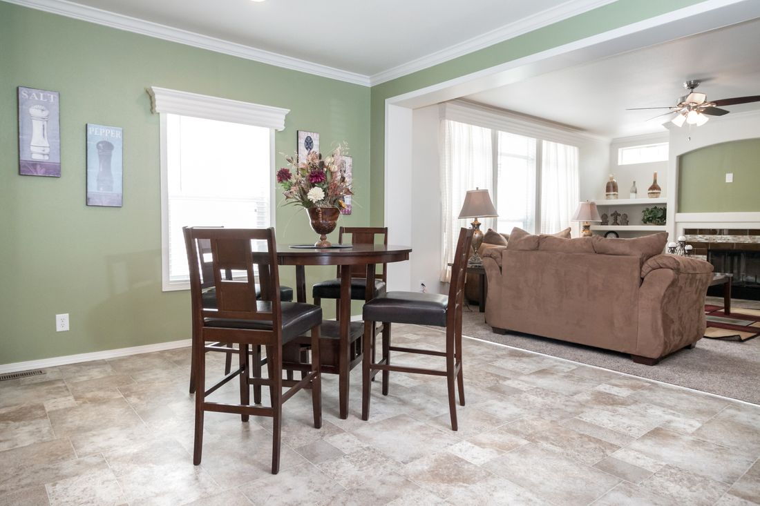 The K3068C Dining Area. This Manufactured Mobile Home features 3 bedrooms and 2 baths.