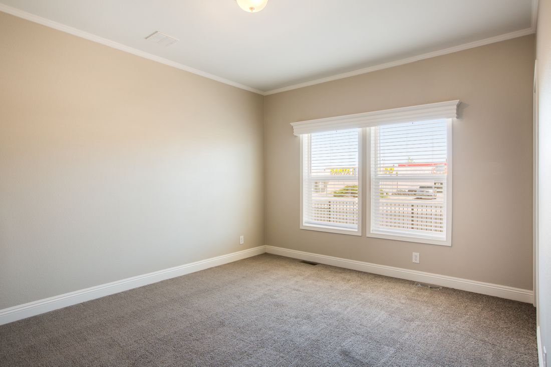 The EDGEWOOD Guest Bedroom. This Manufactured Mobile Home features 3 bedrooms and 2 baths.