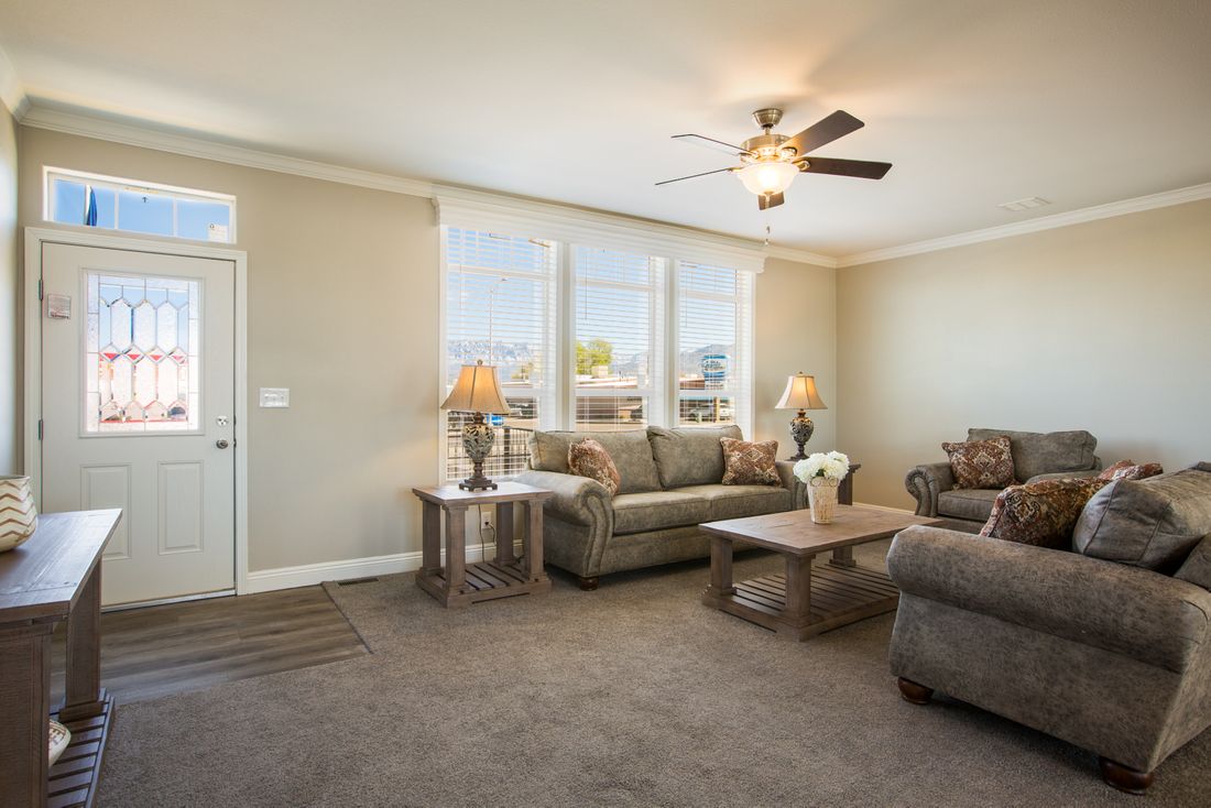 The EDGEWOOD Living Room. This Manufactured Mobile Home features 3 bedrooms and 2 baths.
