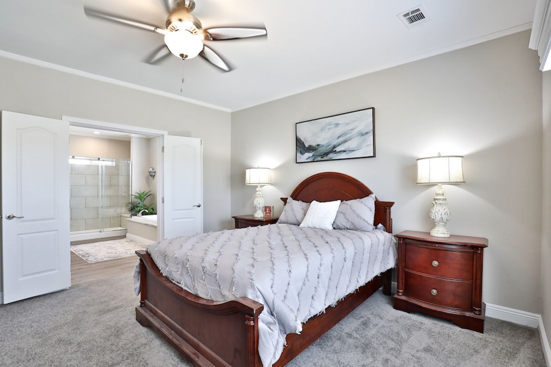 The EDGEWOOD Primary Bedroom. This Manufactured Mobile Home features 3 bedrooms and 2 baths.